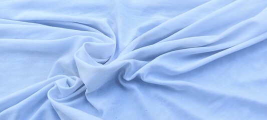Fototapeta premium Waves form abstract textures and patterns on unique bright white cotton fabric