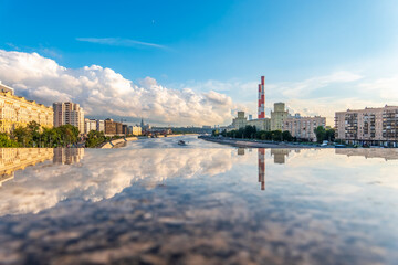 Fototapeta premium View of Berezhkovskaya Embankment in Moscow with reflection on a mirror stone surface