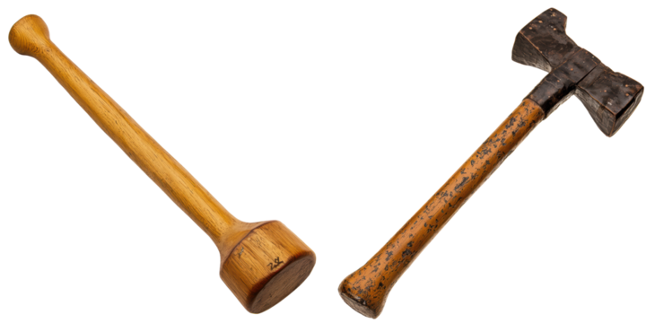 Two wooden hammers on a white isolated background.