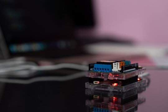 Microcontroller with four relays shield, program and upload to test the operation.