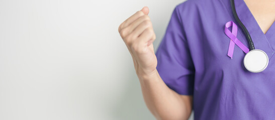 Doctor holding purple Ribbon for Violence, Pancreatic, Esophageal, Testicular cancer, Alzheimer,...