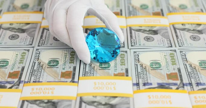 Large blue transparent stack of diamonds made from hundred dollar bills