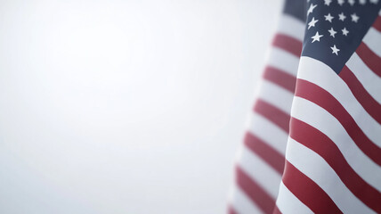 Obraz premium American flag gently waving in a soft, light-filled background during a peaceful moment