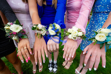 A group of girls and their colorful corsage Flowers for High School Prom. Colorful flower arrangements