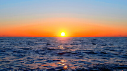 Fototapeta premium A Vivid Sunset Over the Ocean, Casting a Golden Glow on the Rippling Water, Creating a Serene and Majestic Scene