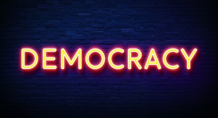 Obraz premium democracy word lettering glowing with neon light on dark brick wall background