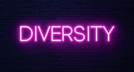 diversity word lettering glowing with neon light on dark brick wall background