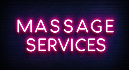 Obraz premium Massage services word lettering glowing with neon light on dark brick wall background