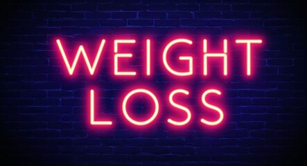 Obraz premium weight loss word lettering glowing with neon light on dark brick wall background