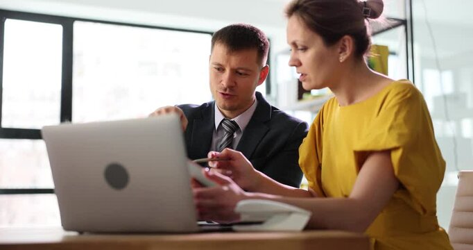 Female office manager listens to paramount wishes for project from influential developer. Employees at conference look for consensus in business plans slow motion