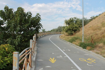 The road is divided into a pedestrian and cycling zone.