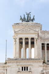 Obraz premium Rome, Italy - April 11, 2024: Rome, Italy - April 11, 2024: monument to Vittorio Emanuele with tourists strolling through the streets in Rome, Italy