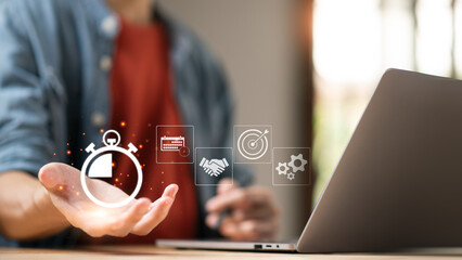 Businessman showing virtual icon in hand, time management concept,effective business planning,time management in the organization,Agreement and solution