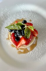delicious cream cheese dessert with seasonal berries, top view