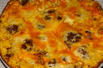 Omelette with meat and cheese for breakfast