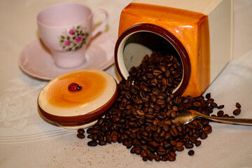 Coffee beans spilled out of a jar