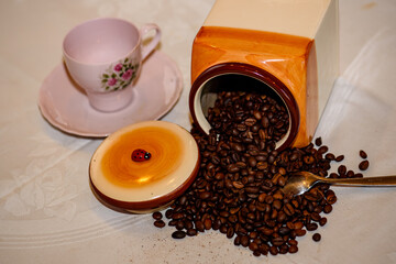 Coffee beans spilled out of a jar