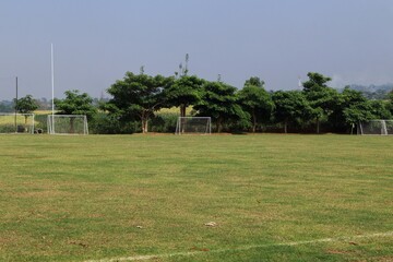 soccer field with balls in natural background in an Indonesian village