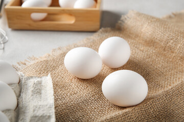 Raw chicken eggs on white background