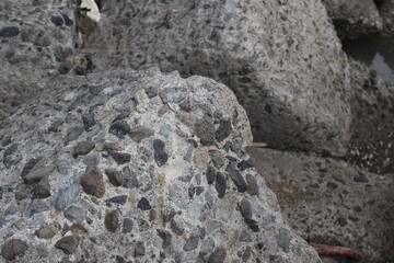 Sea view on the beach with concrete breakwater