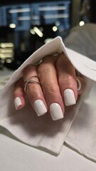 The beauty of the natural nails. Perfect clean manicure. New trendy nail arts on young women hand. Beautiful nail polish in hand