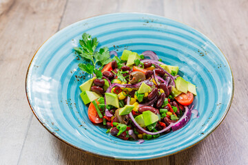 delicious fresh salad. salad with tomatoes, cucumbers and other vegetables with toasted bread and looking great.