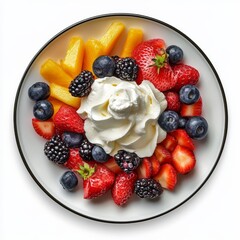 A colorful plate of fresh mixed fruits including strawberries, blueberries, blackberries, and mangoes, topped with whipped cream.