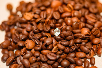A pile of coffee beans spilled on the table