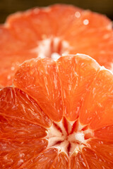 Ripe red grapefruit on a black table