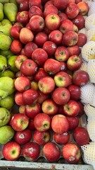Apples,Plum, peach fruits for sale in the market.A bunch of fresh and ripe fruits are for sale .Fruits stall at fruit market.Fruits backgrounds