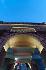 Fototapeta premium Traditional Chinese ancient architecture at the park gate