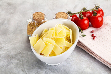 Sliced parmesan cheese in the bowl