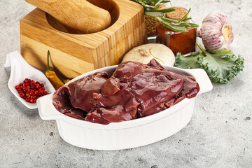 Raw uncooked chicken liver in the bowl