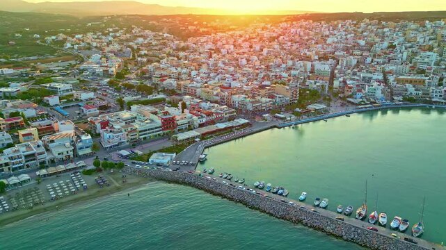 Sunset at the port town of Sitia or Siteia in the municipality in Lasithi, Crete, Greece - push in descent of the marina