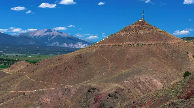 Collegiate Peaks 14ers S Mountain Tenderfoot Hill Salida Colorado aerial drone parallax upward motion Buena Vista Rocky mountain town Chaffee County USA Arkansas River blue sky sunny clouds daytime