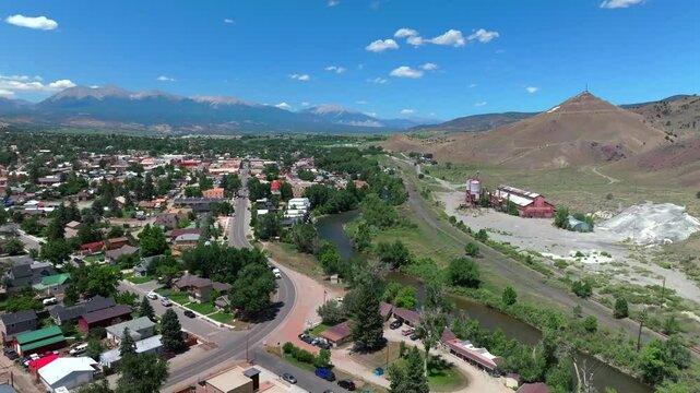 Salida Colorado aerial drone forward up Collegiate Peaks 14ers S Mountain Tenderfoot Hill Buena Vista Rocky mountain town Chaffee County Arkansas River hiking trails blue sky sunny local traffic