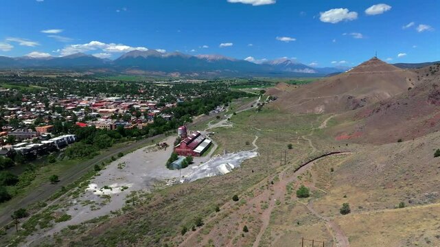 Collegiate Peaks 14ers S Mountain Tenderfoot Hill Salida Colorado aerial drone forward pan up motion Buena Vista Rocky mountain town Chaffee County USA Arkansas River rafting blue sky sunny daytime