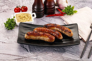 Delicous natural roasted sausages in the plate