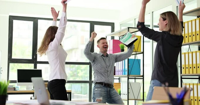 Office employees rejoice after successful raising of goods purchase statistics. Successful entrepreneur team celebrates completion of project