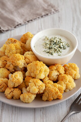 Homemade Buffalo Cauliflower with Blue Cheese Sauce, side view.