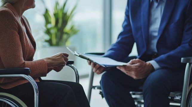 A lawyer discussing disability rights with a client, providing guidance on legal protection