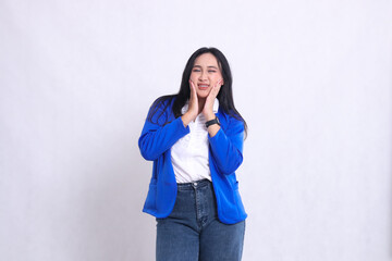 expression of beautiful young office woman wearing formal suit standing to camera wincing in pain toothache both hands holding cheeks. for company content, health, business, care, drinks