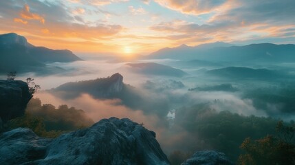 Fototapeta premium hazy panorama of the landscape. Wonderfully surreal dawn on rugged peaks, offering a glimpse of the foggy valley beneath. cloud cover above the forest. A view of the fanciful countryside below. 