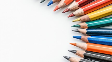 Fototapeta premium Colorful pencils arranged neatly on a white background for drawing