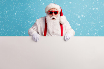 Portrait of his he nice attractive funky amazed stunned white-haired Santa holding in hands copy...