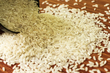 White rice bowl in wood isolated, Concept of Water-Conserving Products. Saving water. Horizontal orientation. Raw basmati rice on  wooden

