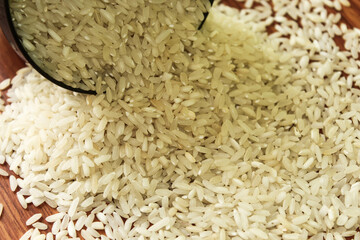 White rice bowl in wood isolated, Concept of Water-Conserving Products. Saving water. Horizontal orientation. Raw basmati rice on  wooden
