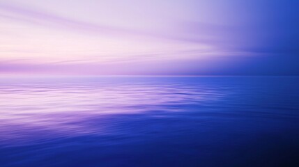 Obraz premium The calm ocean reflects the setting sun, creating a peaceful atmosphere with vibrant colors perfect for relaxation and meditation