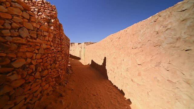 Cinguetti or Chinguetti holy city of Islam in desert of Mauritania. Walls of Old Town. First-person walking