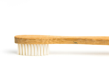 wooden or bamboo sustained tooth brush isolated in white background